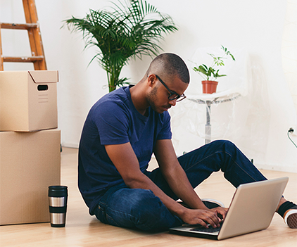 Man working on a computer in a modern apartment